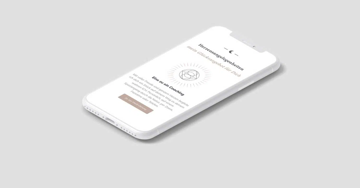weißes Handy mit Layout in weiß mit goldener Schrift und Button. Weitere Schrift in Schwarz gehalten